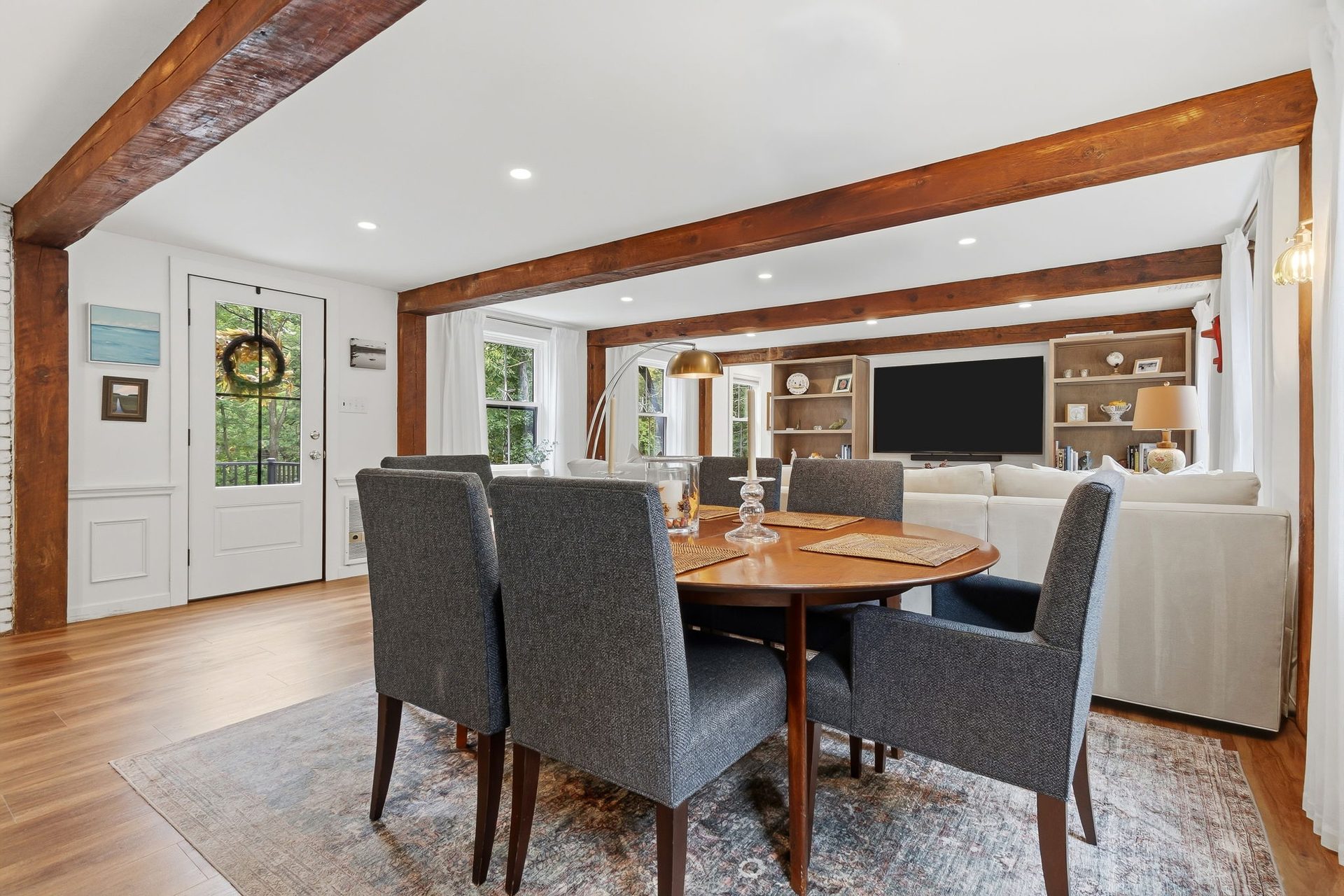The dining table with the living room behind it