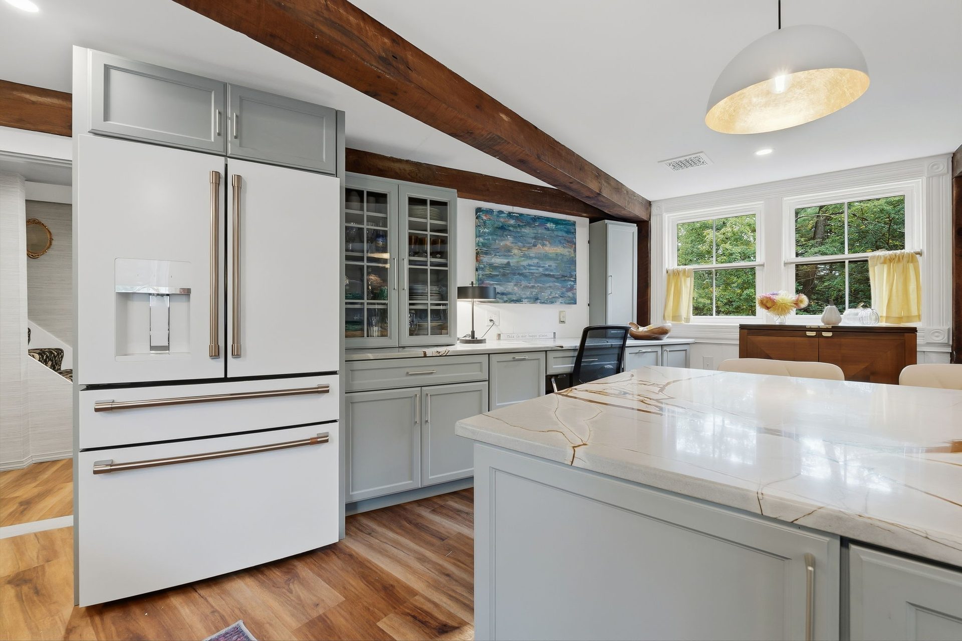 The refrigerator and glass-front cabinets